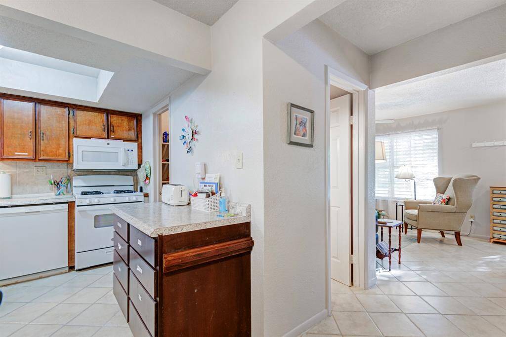 Kitchen and living room to the right.
