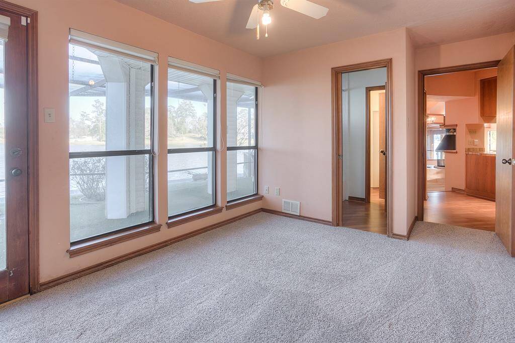 Downstairs bedroom open to full bathroom and kitchen area.