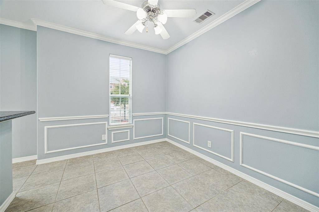 This flexible space can be used as a breakfast room or a cozy sitting area.