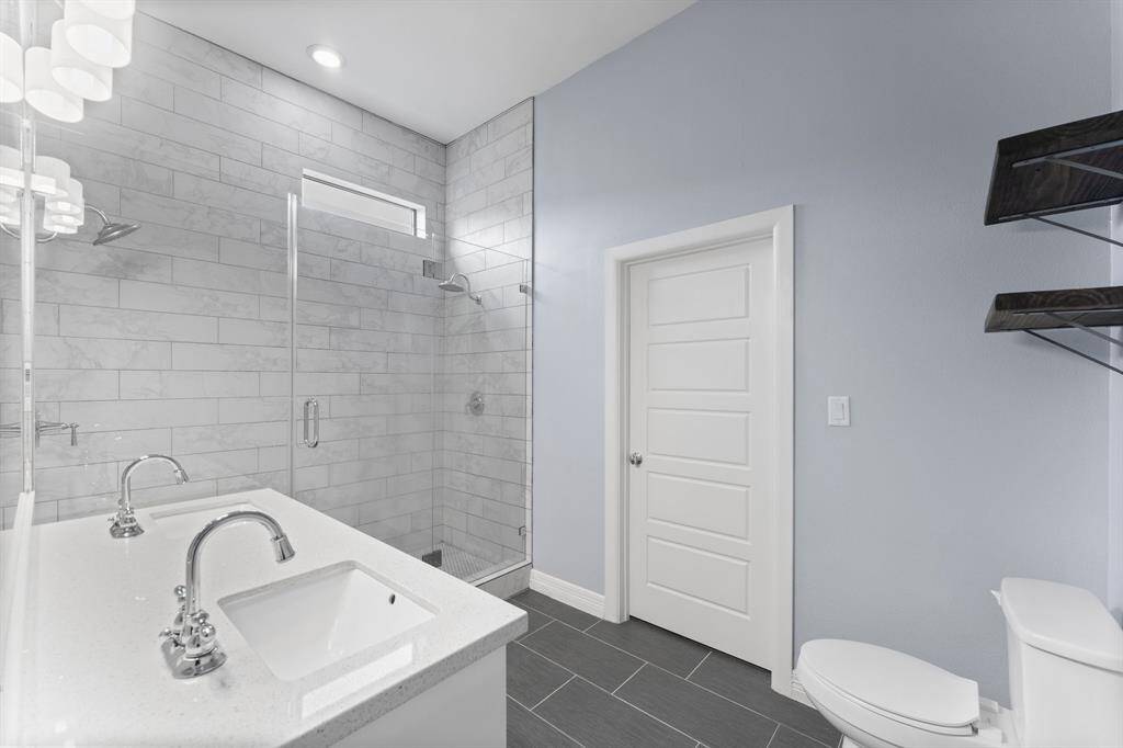 Bathroom with double sinks, large walk in shower and large closet.