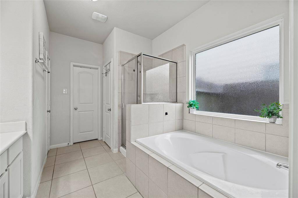 Relax in your deep soaking tub or opt for a quick rinse in the separate shower.