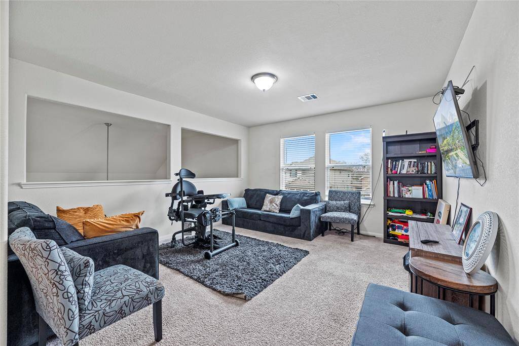 The whole family will love the expansive game room overlooking your living space below.