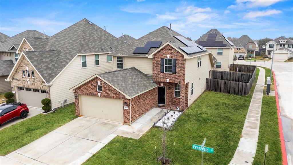 This impressive aerial view showcases the prime location of this beautiful corner lot.