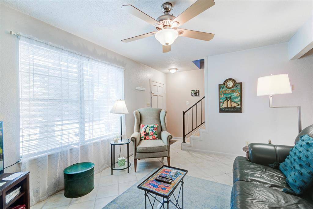 View from living room of the front door/ entryway and stairs leading to the bedrooms.