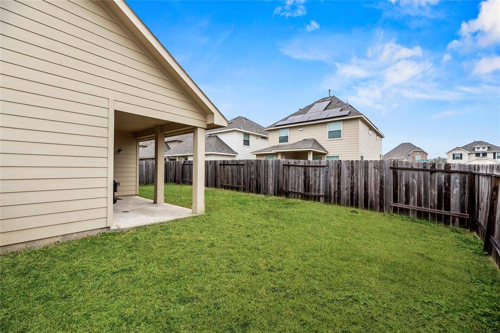 Now this is where the fun begins. Covered porch provides an area to relax and enjoy the large backyard.