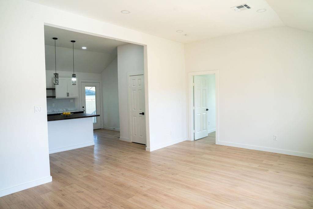 Bright and spacious open-concept living area with modern finishes! Perfect for entertaining and family gatherings.