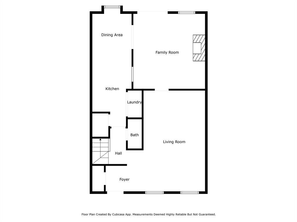 This floor plan features a welcoming foyer leading to a spacious living room-dining room combination. Adjacent is a hallway connecting to the powder room and laundry area. The layout flows into a kitchen and breakfast area, with a family room at the back, perfect for gatherings.