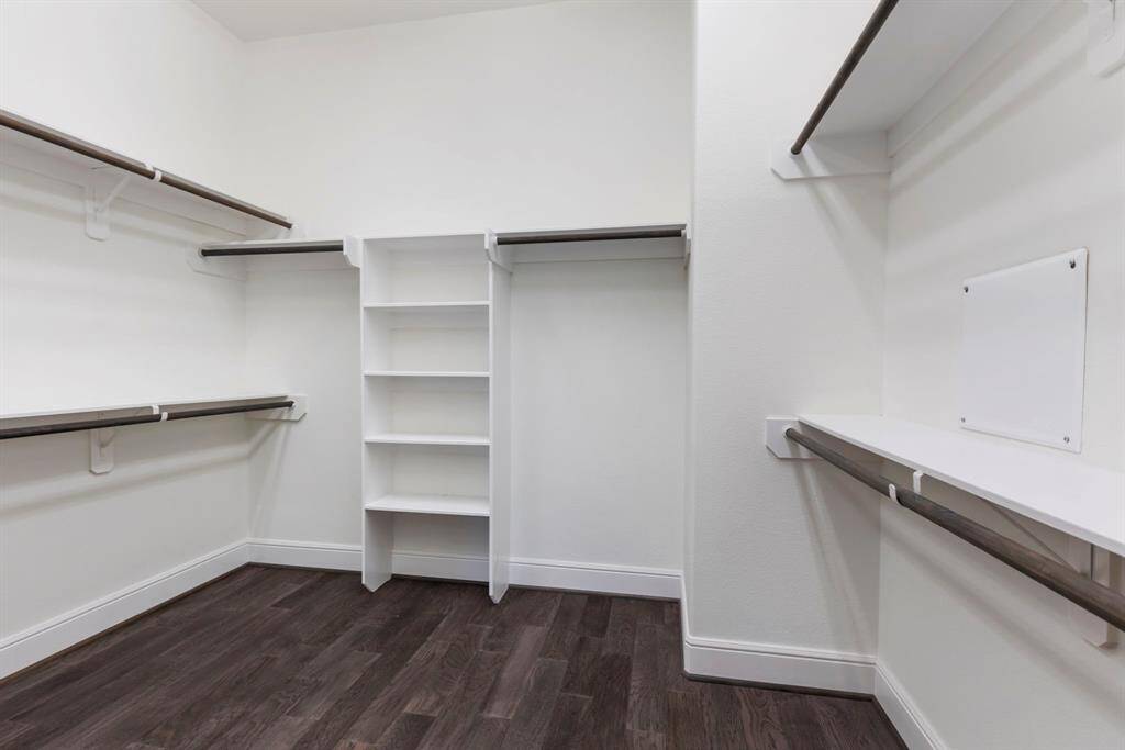 The primary closet is a dream come true, offering an abundance of space for all your storage needs!