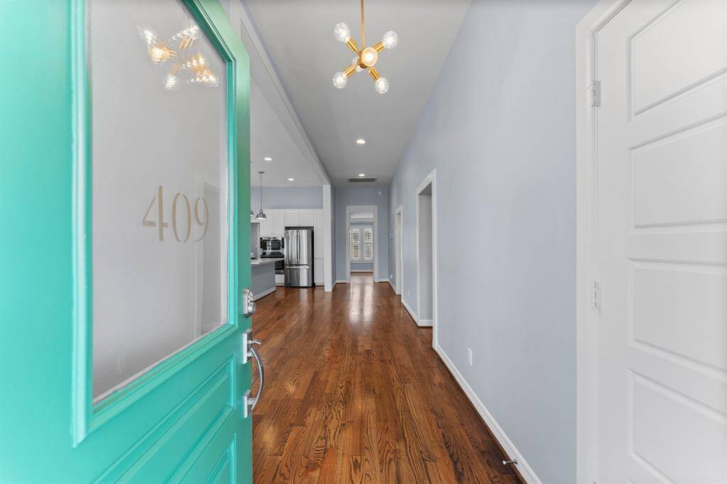 First glimpse provides a view of the adorable home with wood floors and many little touches.