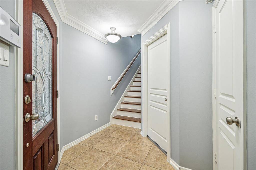 The first floor features an oversized secondary bedroom, which was previously used as an office and game room.