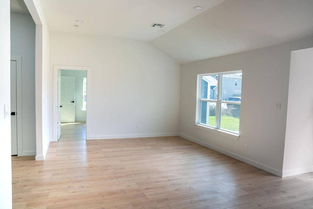 Spacious and bright open-concept living area with contemporary finishes, ideal for entertaining and family gatherings.