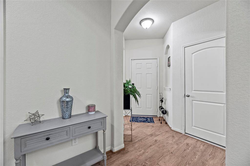 The moment you step in you feel a beautiful calming sense from this home with it's light and airy vinyl, wood plank flooring.