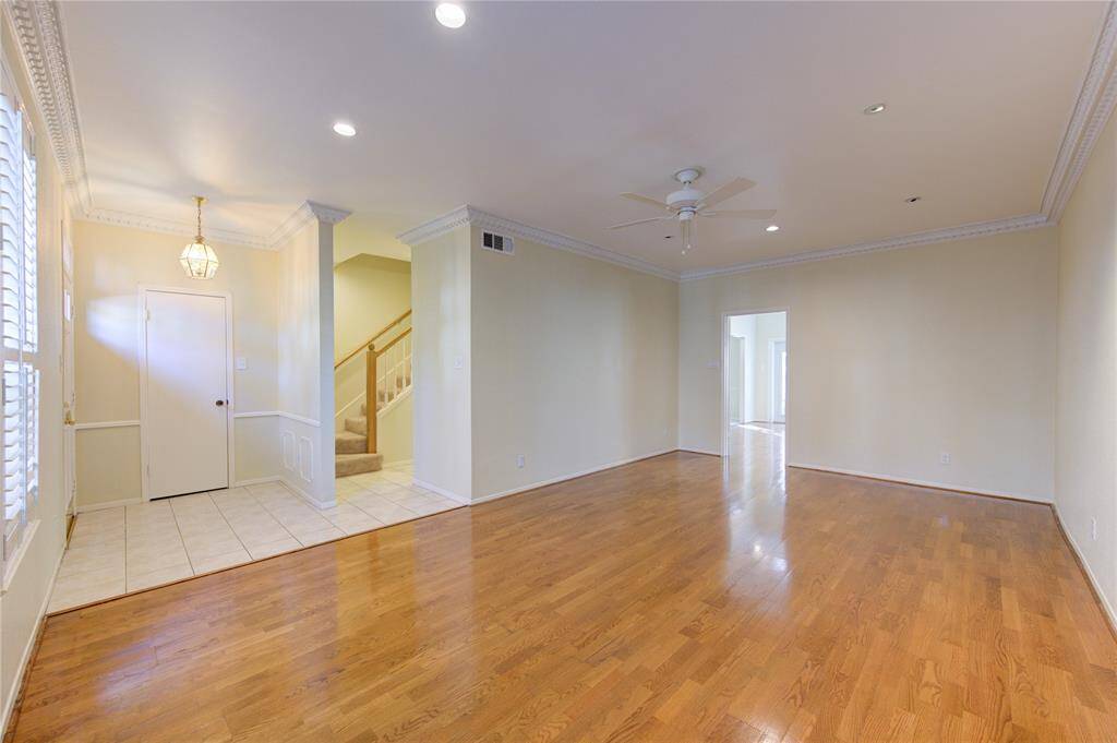 Elegant living and dining area with engineered wood floors and abundant natural light. Perfect for entertaining.