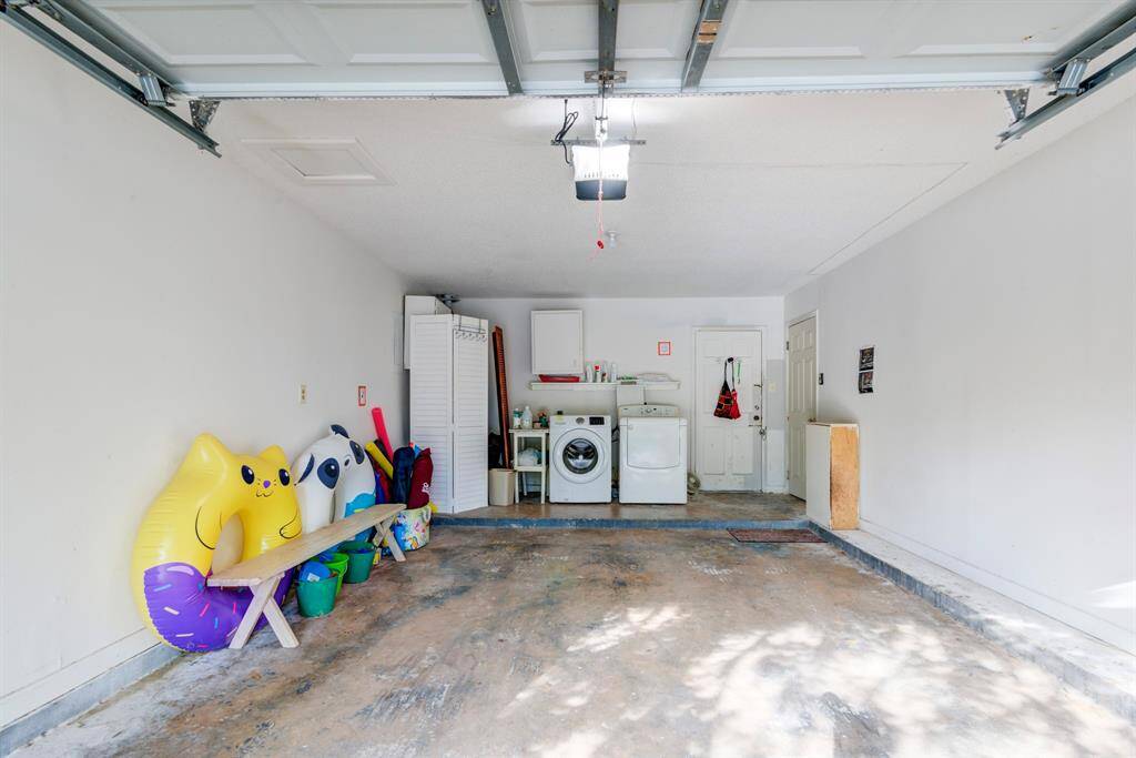 Laundry room in garages on both units