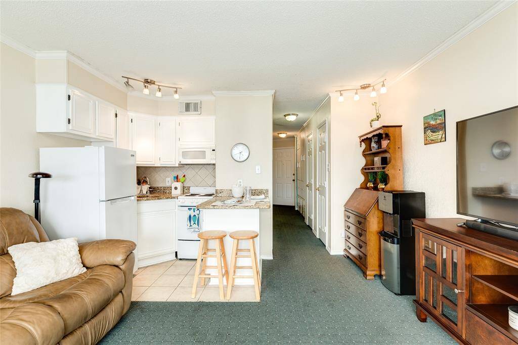 Living with tv area and room for dining nook.