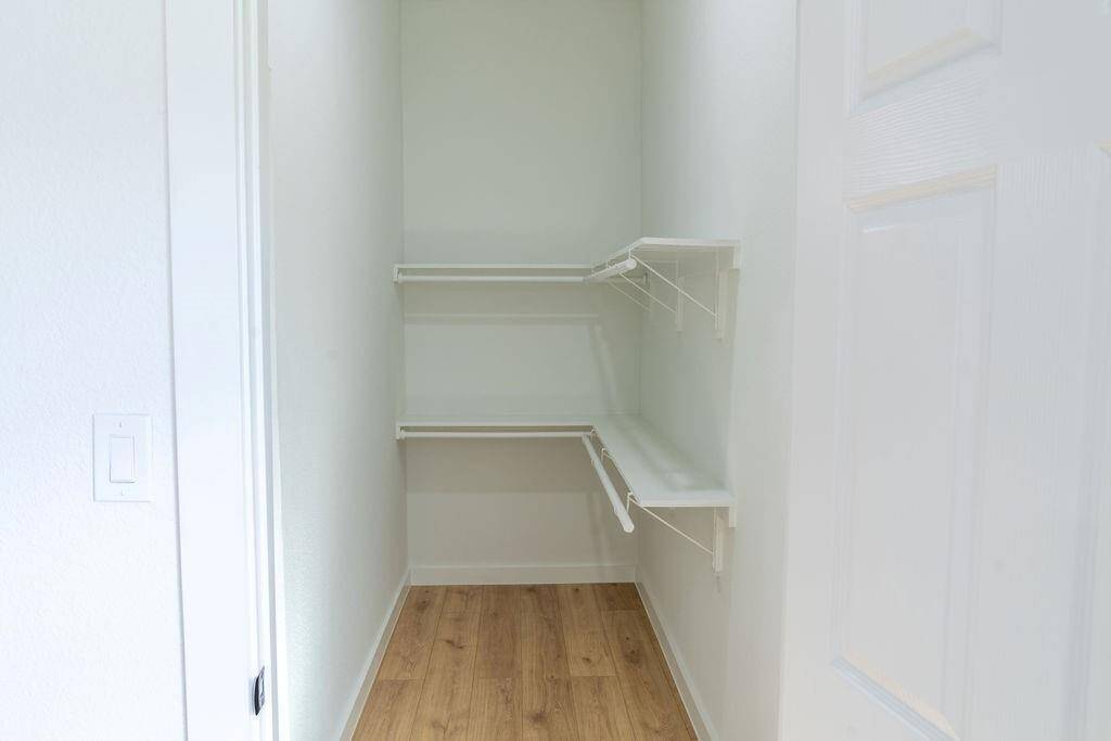 Newly updated, walk-in closet offering efficient storage space.