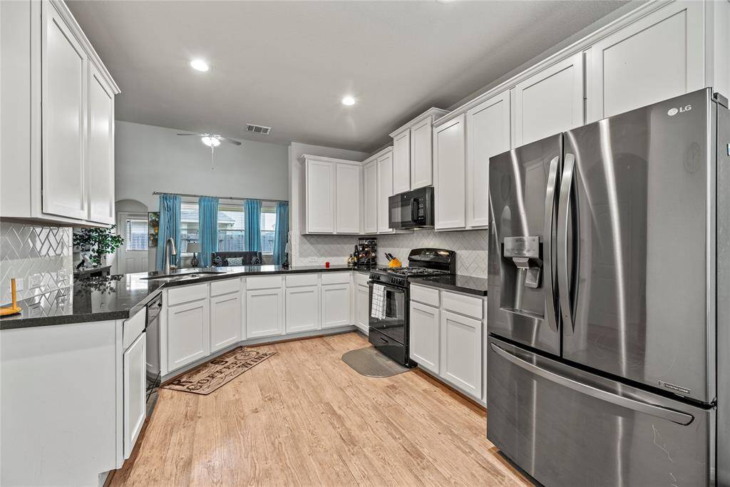 Step into the kitchen with an abundance of cabinet space!
