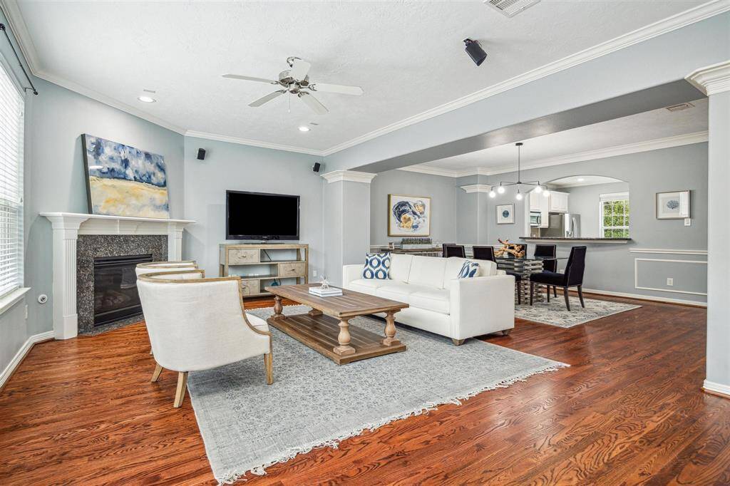 The living, dining, and kitchen seamlessly flow together, creating the perfect space for entertaining or unwinding.