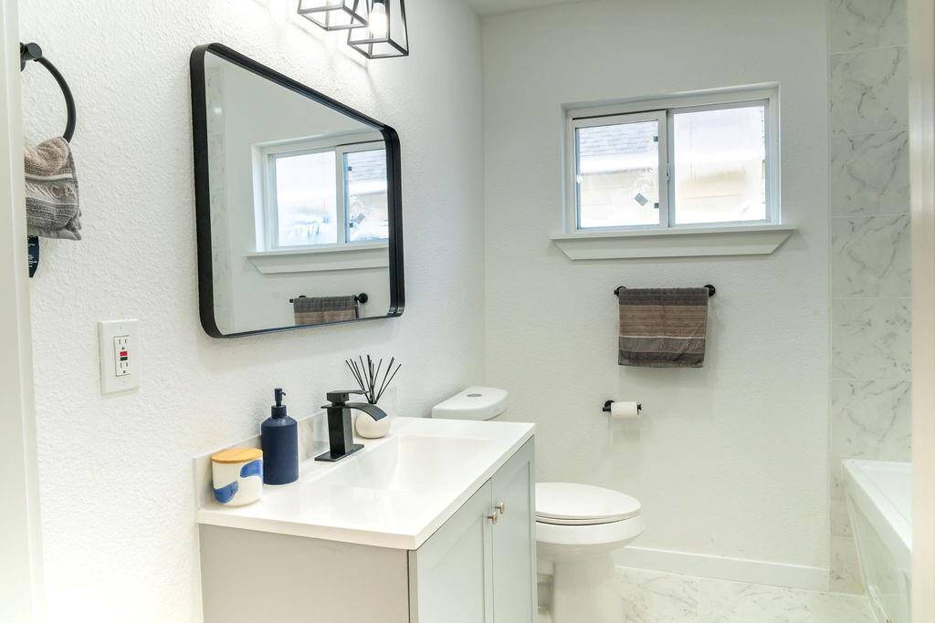 Two full bathrooms, both featuring modern updates and stylish finishes.