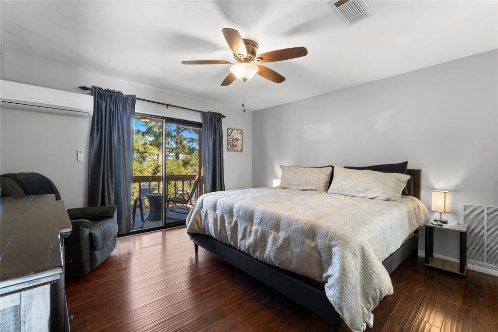 Large private primary shite with private balcony; also features a mini-split for extra cooling