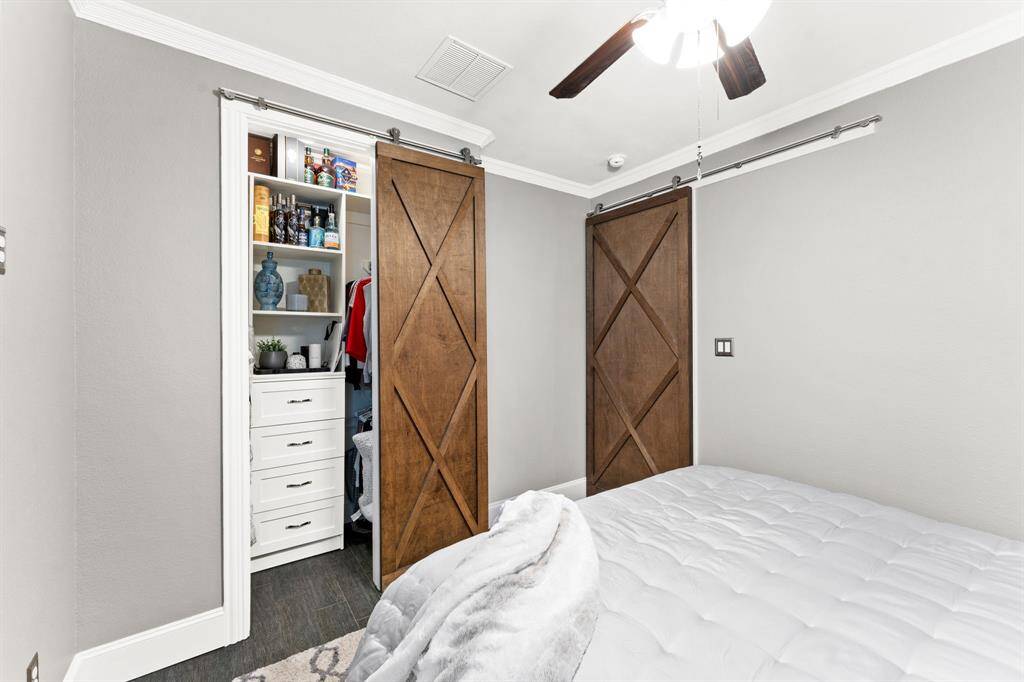 Guest Bedroom with Custom closet and 2 barn doors.