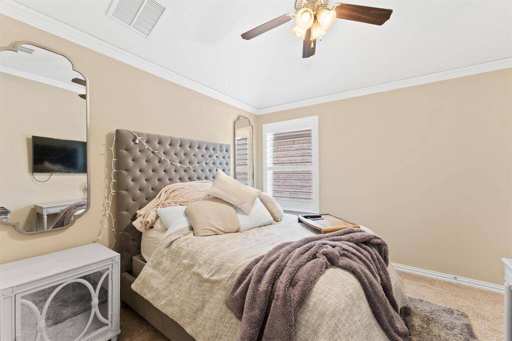 1  of 2 upstairs bedrooms with high ceiling.