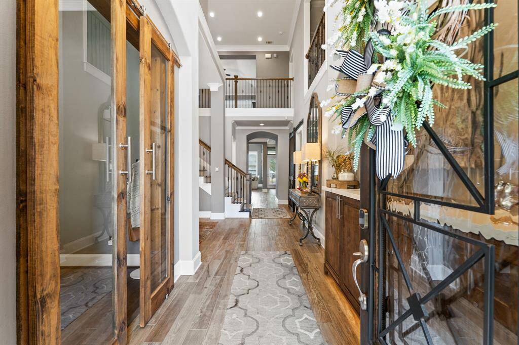 Looking back at the front door, you will notice all the matching stained maple built ins for massive amounts of storage. Huge Restoration Hardware foyer Chandelier.