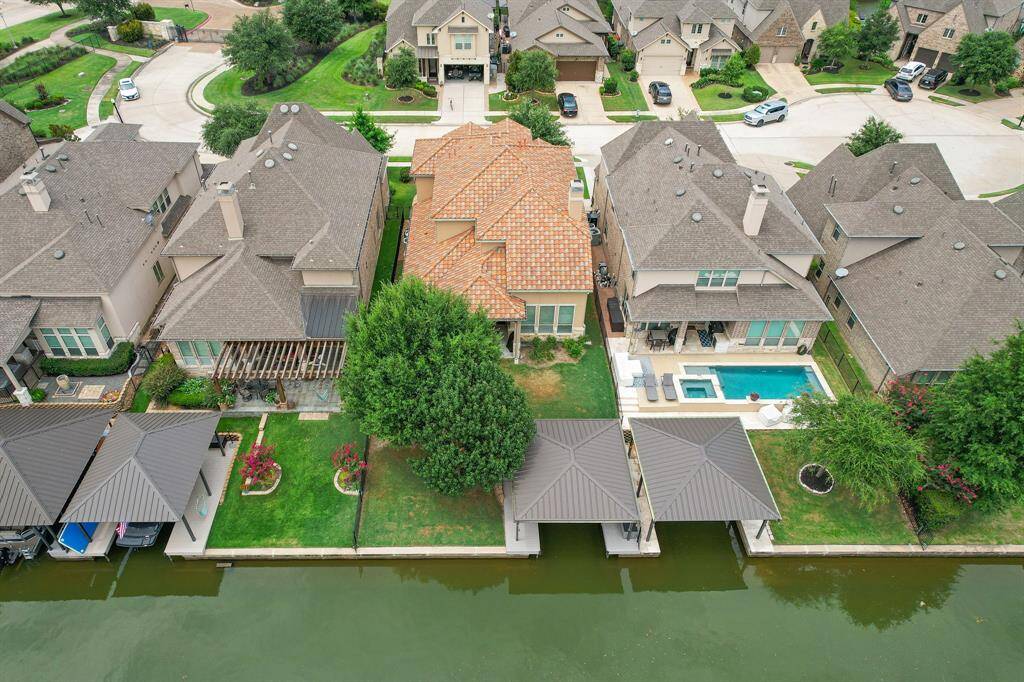 Welcome to the  Waterway section of Towne Lake.  This Home is located on a 15 home cul de sac with private, gated access.  Home has its own Boathouse and dock. No Marina Fees!