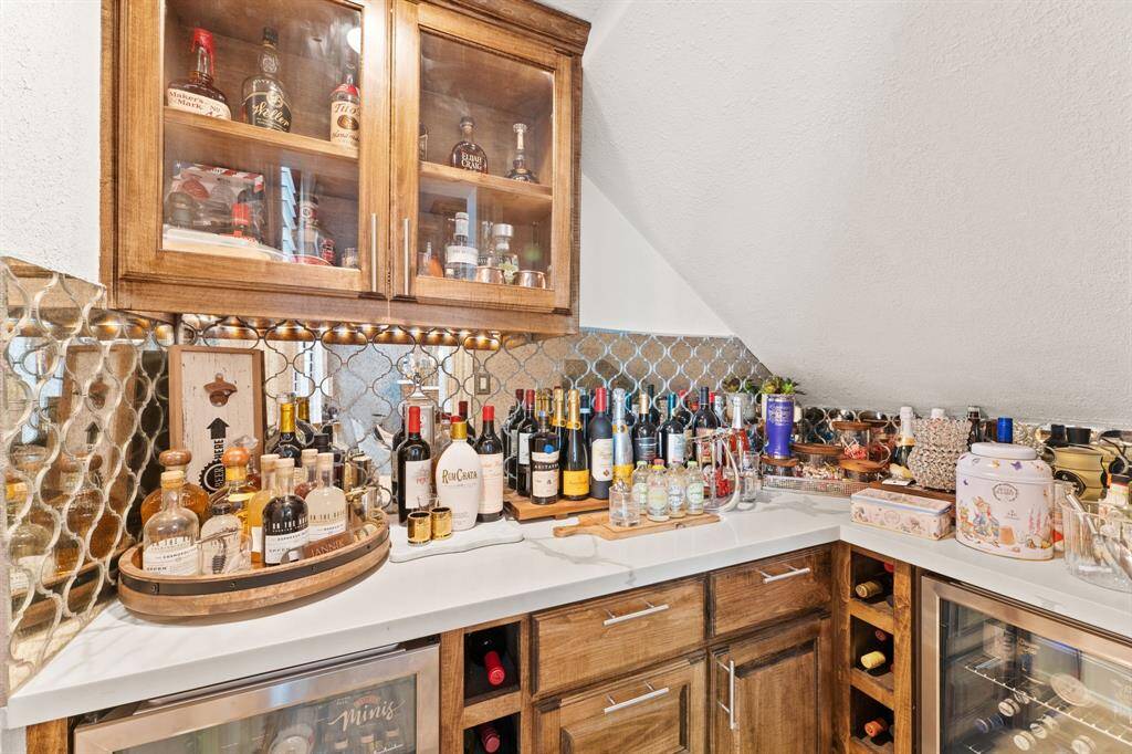 This picture states it all:  led, glass cabinet uppers, top of the line appliances, and gorgeous pendant lighting.