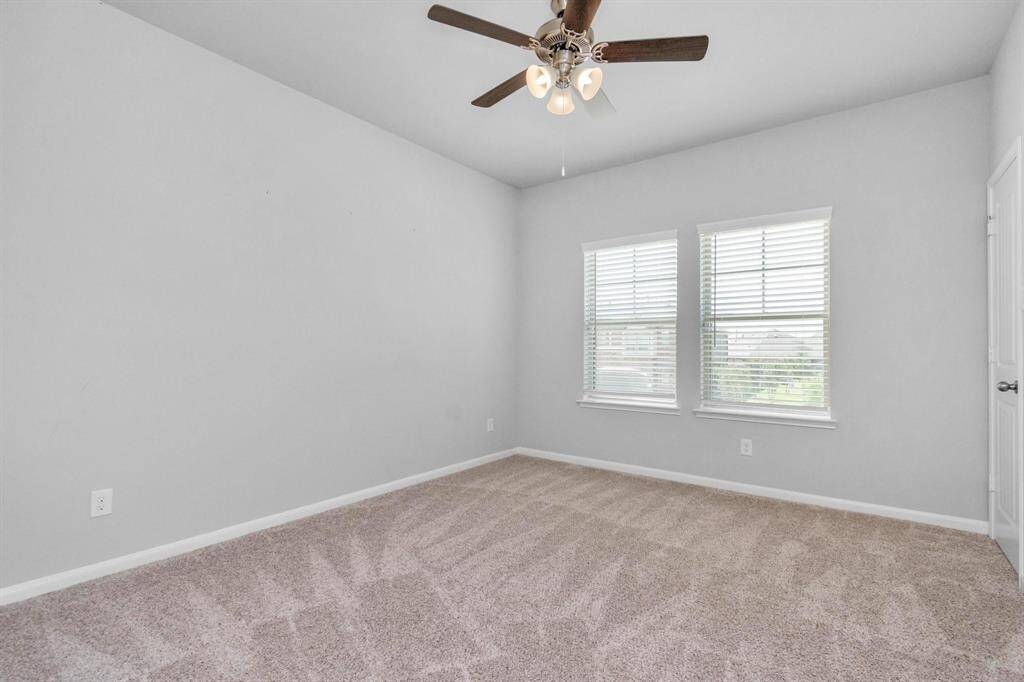 Secondary Bedroom #2 has long walk in closet with bench seating