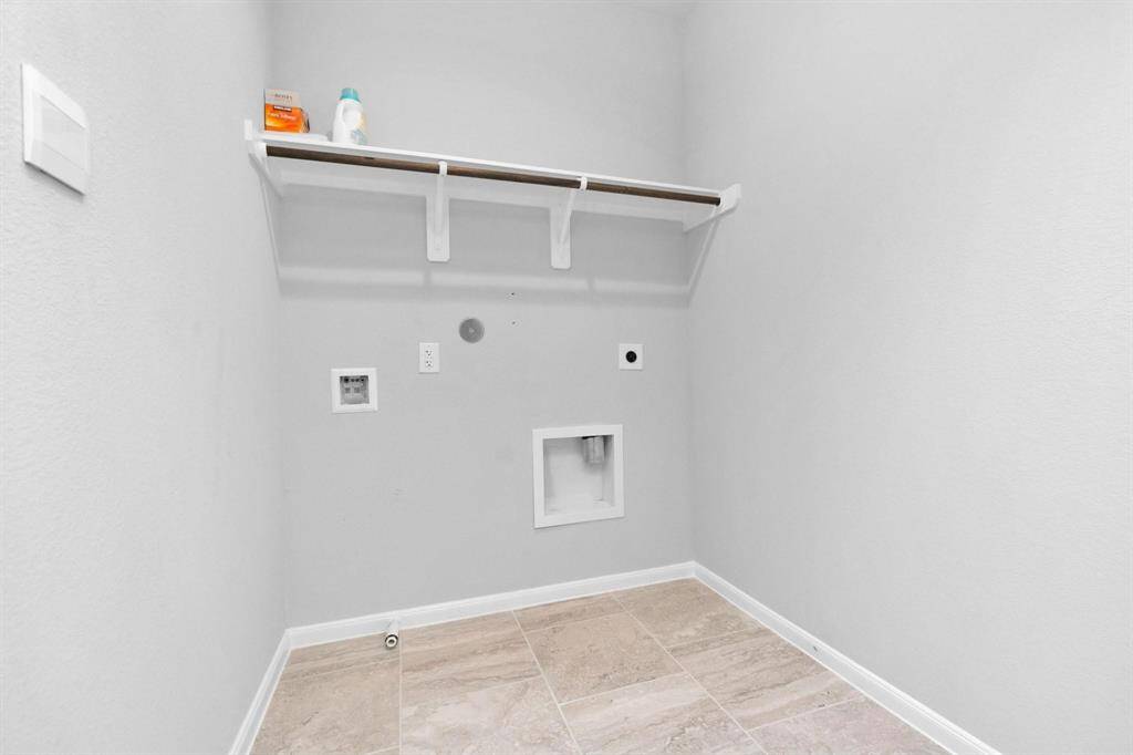 Utility Room conveniently located upstairs off game room
