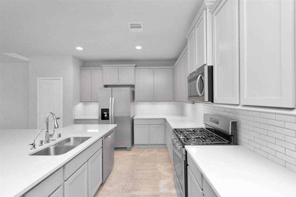 Spacious kitchen with tons of cabinets for storage