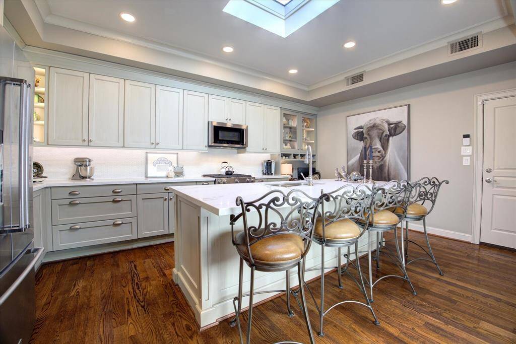 This cook's kitchen is fully outfitted with ample prep space, KitchenAid appliances and generous storage.