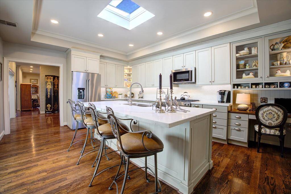 The Brookhaven by Wood-Mode cabinetry was custom designed, built and installed for this space.
