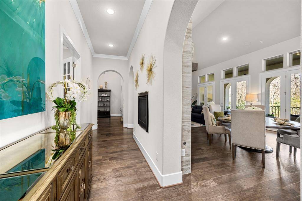Two way fireplace is the centerpiece of the living area just behind it is the study with custom built ins
