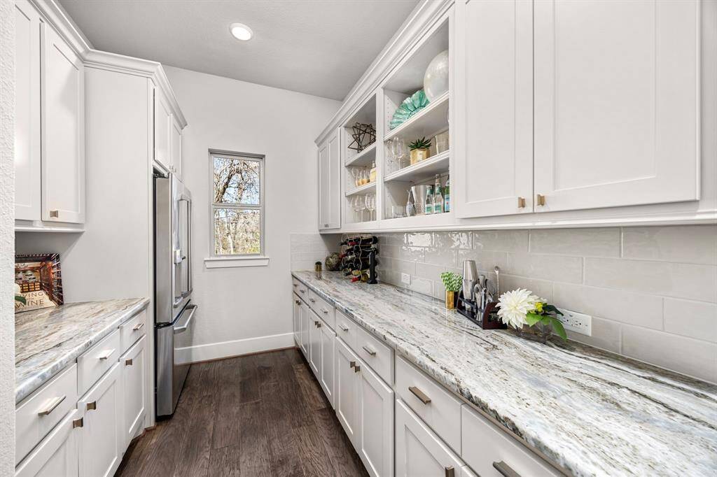 Butlers Pantry features even more storage and meal prep area, with a walk through pantry