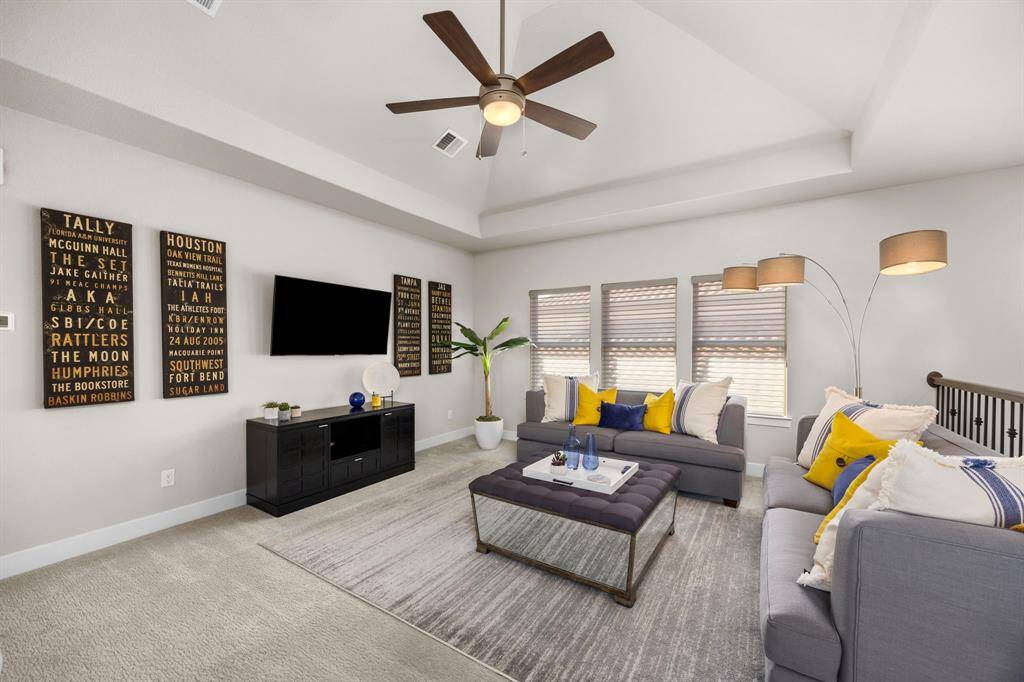 The upstairs game room offers another inviting area for watching the game