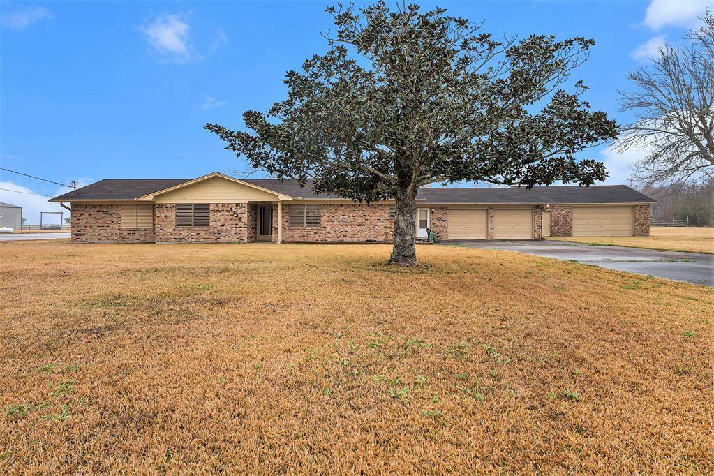 Charming brick home with spacious yard, nestled in a serene setting. Perfect for comfort and relaxation. Welcome home!
