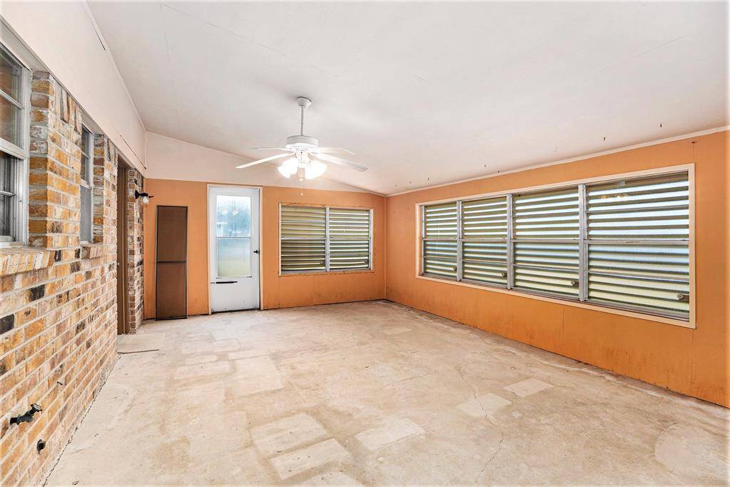 Bright and inviting enclosed sunroom, perfect for year-round enjoyment and relaxation.