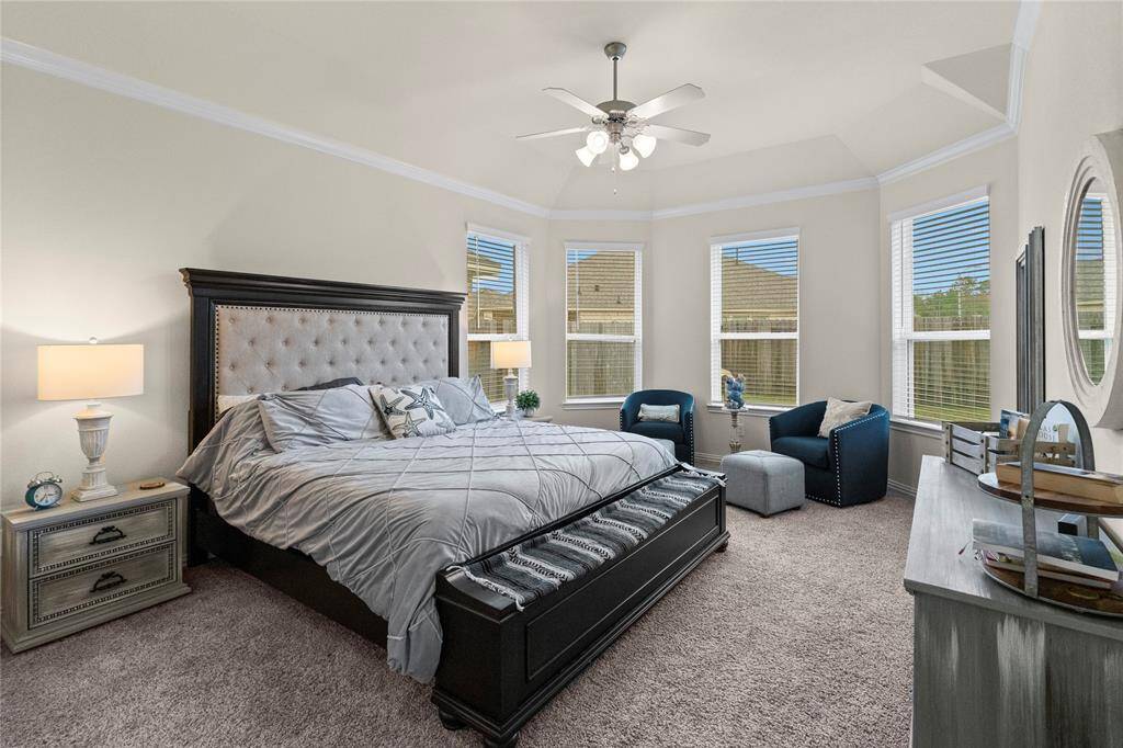 The primary bedroom has ample natural light from the bay window!