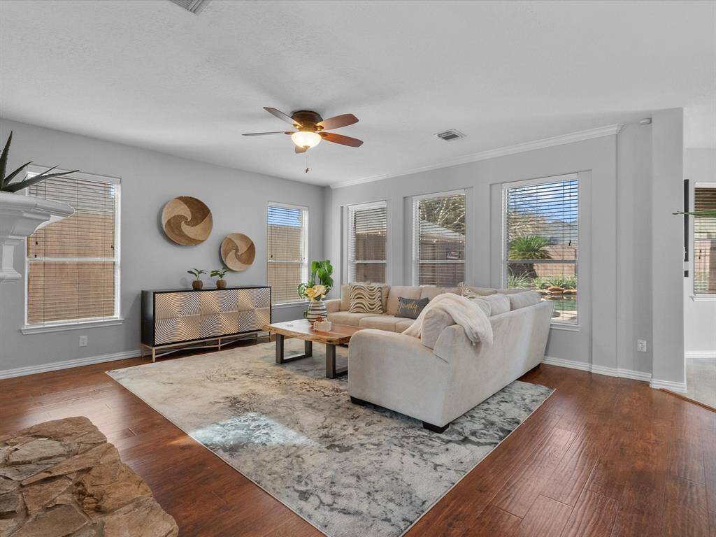 Bright family room with ample seating space and outdoor views.