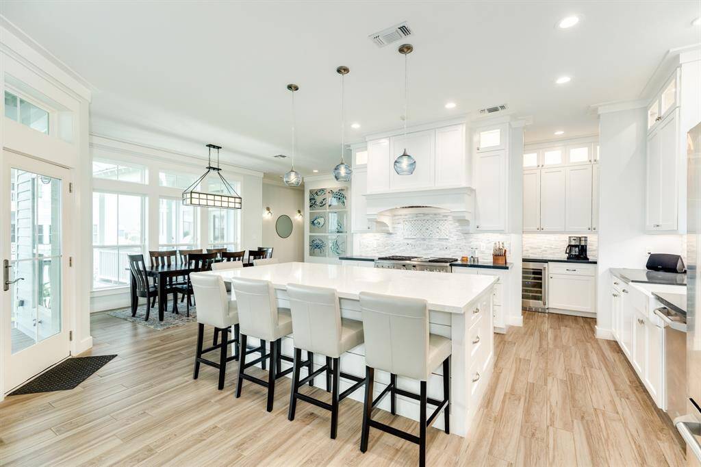 Such a wonderful, open feeling in the social areas of the home!  Sit down, have a cup of coffee and chat with your friends!
