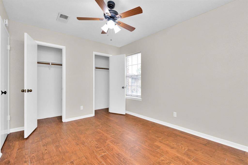 2nd bedroom with wood like tile flooring