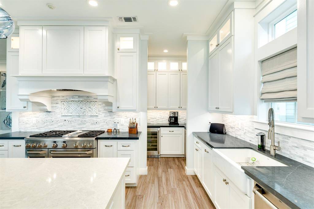 Tucked behind the kitchen wall is the butler's pantry - wine refrigerator and icemaker tucked away.  Also the coffee bar.