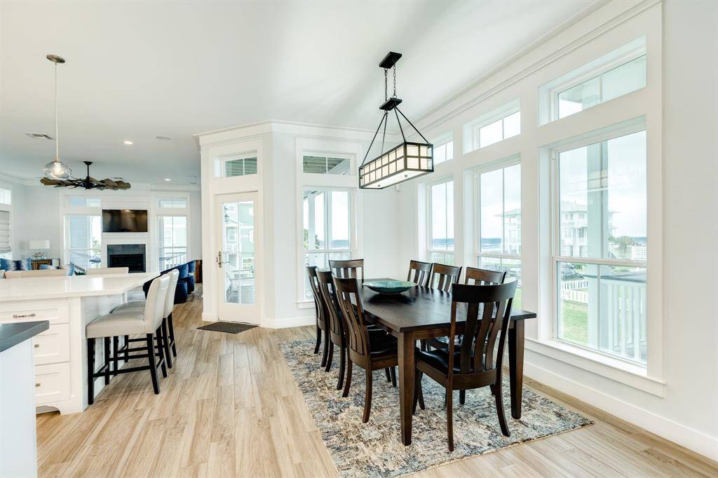 Lovely dining room with a large table to seat 8 people.  Again, more windows!