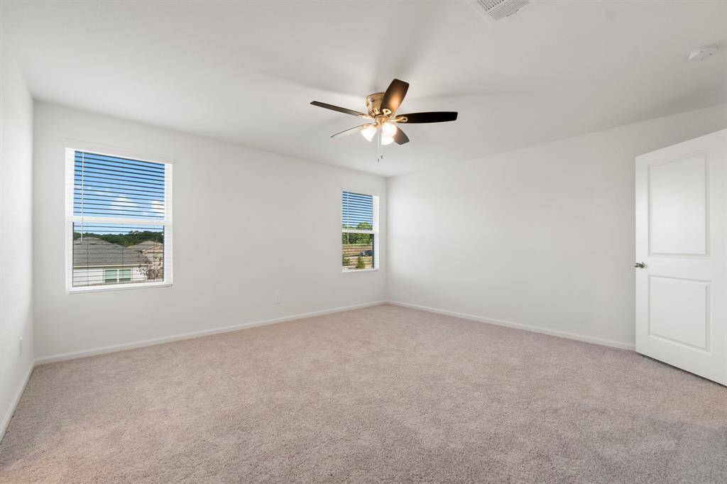 This spacious upstairs primary bedroom is designed for ultimate comfort and relaxation. Featuring a private en-suite bathroom, you'll enjoy convenience and privacy at your fingertips.