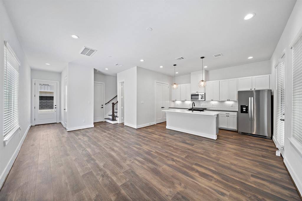 Open concept floor plan with living space located on the first floor and bedrooms on the second floor. High ceilings and natural light throughout the home.