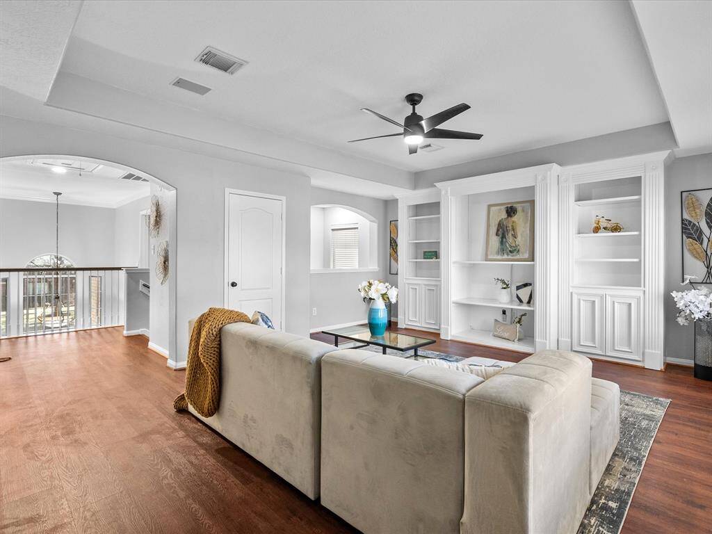 Game room with built-in shelving and a cozy atmosphere perfect for family gatherings