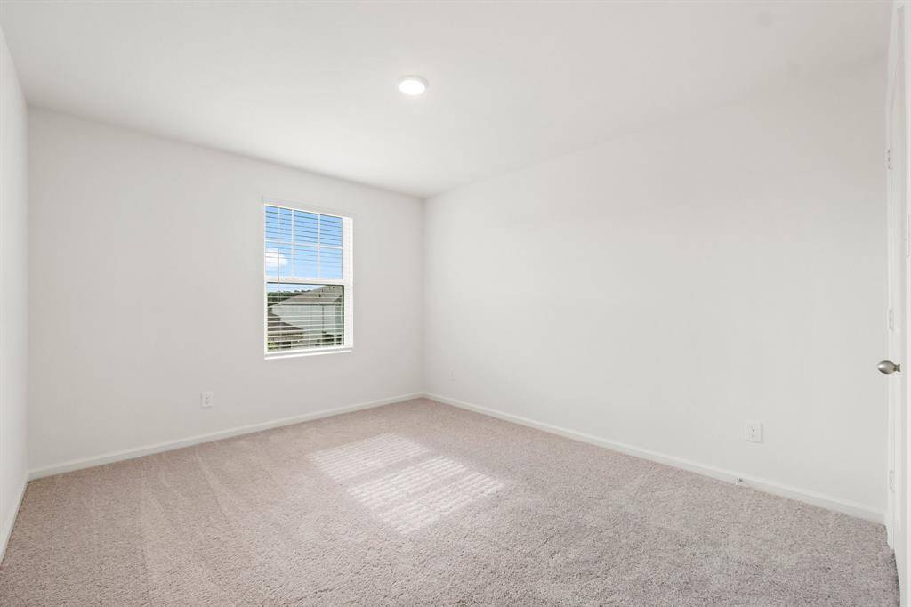 Another secondary bedroom ideal for a bedroom, guest room, home office or flex space.