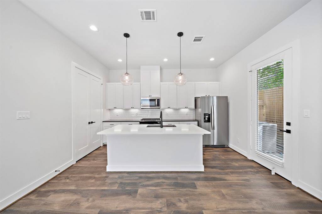 Quartz topped island will be the gathering place for your guest with counter height bar seating.
